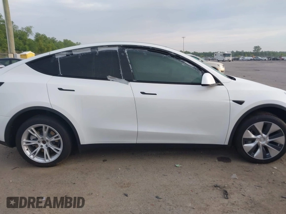 2023 Tesla Model Y Long Range with VIN 7SAYGDEE4PF770307, listed as a IAAI auction lot 42141175 with 34,901 mi miles and . Bid and sale history available at carsss.com. Image 14.