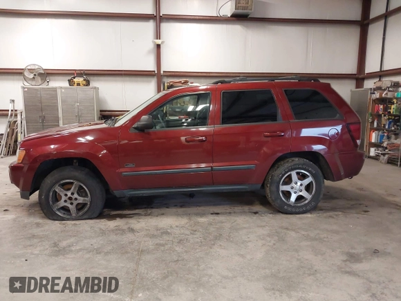 2007 Jeep Grand Cherokee Laredo with VIN 1J8GR48K97C631672, listed as a IAAI auction lot 41520054 with 231,576 mi miles. Bid and sale history available at carsss.com. Image 14.