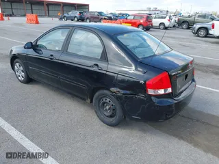 2009 Kia Spectra EX with VIN KNAFE221495631702, listed as a IAAI auction lot 41875896 with 234,550 mi miles. Bid and sale history available at carsss.com. Image 3.