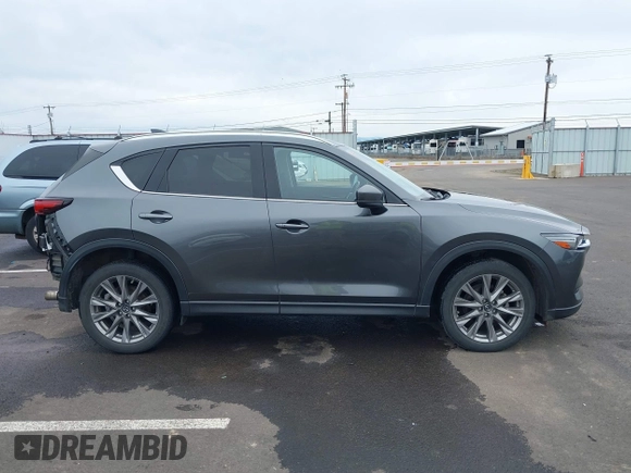 2020 Mazda CX-5 Grand Touring with VIN JM3KFBDM4L0829861, listed as a IAAI auction lot 41826250 with 62,091 mi miles and . Bid and sale history available at carsss.com. Image 14.