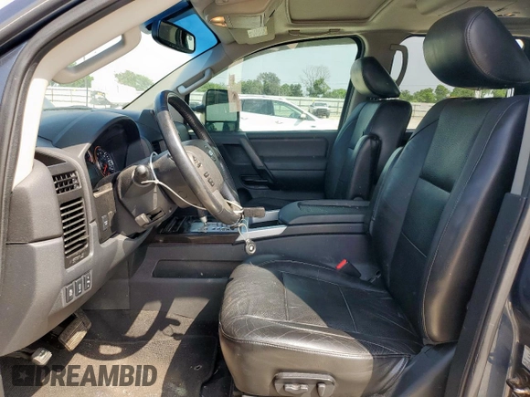 2013 Nissan Titan Pro-4X with VIN 1N6BA0EC3DN310741, listed as a Copart auction lot 57171975 with 146,524 mi miles and Salvage title. Bid and sale history available at DreamBid. Image 7.