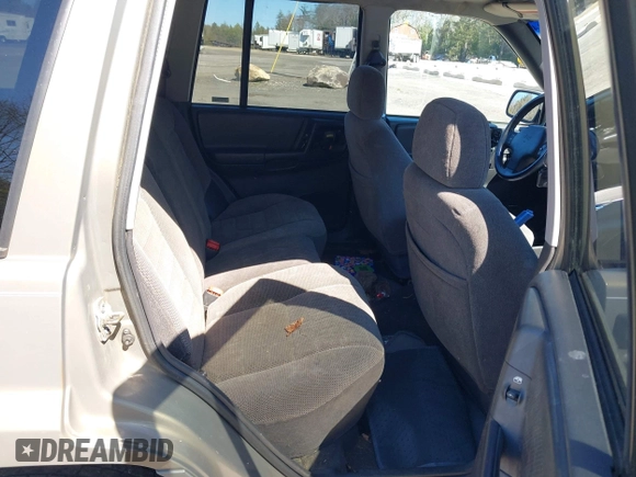 1997 Jeep Grand Cherokee Laredo with VIN 1J4GZ58S7VC713517, listed as a IAAI auction lot 42062214 with 205,533 mi miles. Bid and sale history available at carsss.com. Image 8.