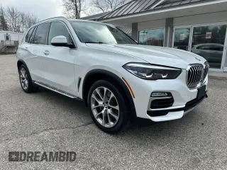 2019 BMW X5 xDrive40i with VIN 5UXCR6C56KLK99829, listed as a Copart auction lot 51001235 with 165,939 mi miles and Clean Title. Bid and sale history available at carsss.com. Image 1.