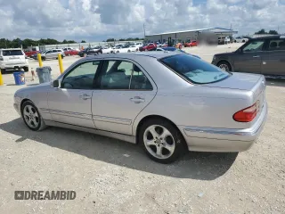 2002 Mercedes-Benz E-Class with VIN WDBJF65J02B495961, listed as a Copart auction lot 73844554 with 99,380 mi miles and Salvage Title. Bid and sale history available at carsss.com. Image 2.