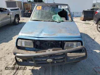 1995 Geo Tracker z VIN 2CNBE18UXS6930601, wystawiony jako Copart lot #76079094 z przebiegiem 276 136 mil mil oraz Szkody całkowita. Historia ofert i sprzedaży dostępna na DreamBid. Obrazek 5.