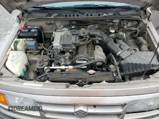 1997 Suzuki Sidekick JX z VIN 2S3TD03V4V6403519, wystawiony jako Copart lot #49666085 z przebiegiem 54 577 mil mil oraz Szkoda całkowita • Salvage title. Historia ofert i sprzedaży dostępna na DreamBid. Obrazek 13.
