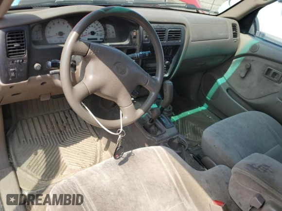 2002 Toyota Tacoma with VIN 5TEWM72N02Z885559, listed as a Copart auction lot 66627045 with Not provided miles and Clean title. Bid and sale history available at DreamBid. Image 8.