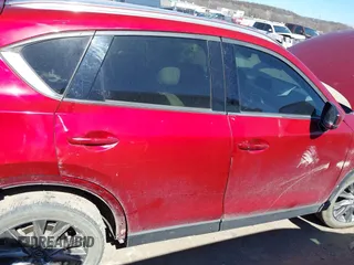 2020 Mazda CX-5 Grand Touring with VIN JM3KFADM3L0761286, listed as a IAAI auction lot 41715379 with 145,656 mi miles and . Bid and sale history available at DreamBid. Image 14.