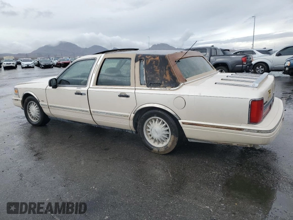 1995 Lincoln Town Car Cartier z VIN 1LNLM83W2SY603452, wystawiony jako Copart lot #55756595 z przebiegiem 243 394 mil mil oraz Szkoda całkowita • Salvage title. Historia ofert i sprzedaży dostępna na DreamBid. Obrazek 2.