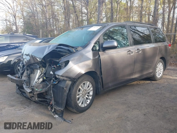 2011 Toyota Sienna XLE AAS with VIN 5TDYK3DC2BS093980, listed as a IAAI auction lot 42064568 with 196,893 mi miles. Bid and sale history available at carsss.com. Image 2.