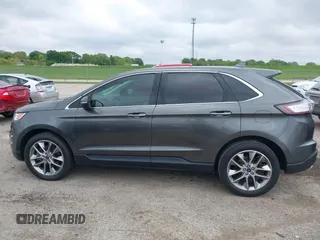 2015 Ford Edge Titanium z VIN 2FMTK3K81FBB88882, wystawiony jako IAAI lot #42184698 z przebiegiem 161 858 mil mil oraz . Historia ofert i sprzedaży dostępna na DreamBid. Obrazek 14.