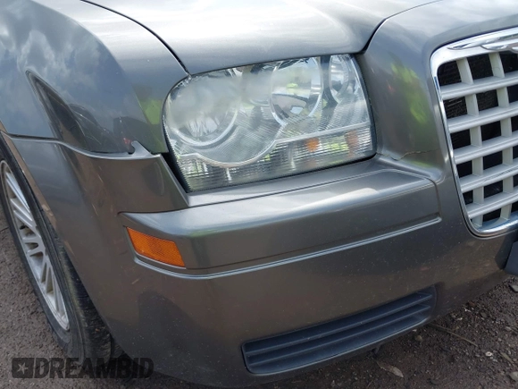 2009 Chrysler 300 LX with VIN 2C3KA43D49H558006, listed as a IAAI auction lot 42178195 with 208,864 mi miles and . Bid and sale history available at DreamBid. Image 6.