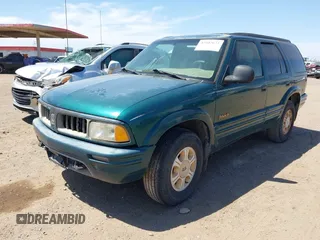 1996 Oldsmobile Bravada z VIN 1GHDT13W5T2711291, wystawiony jako IAAI lot #42502672 z przebiegiem 219 062 mil mil oraz . Historia ofert i sprzedaży dostępna na DreamBid. Obrazek 2.
