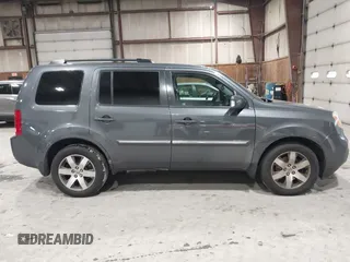 2012 Honda Pilot Touring with VIN 5FNYF4H99CB052034, listed as a IAAI auction lot 42023430 with 137,428 mi miles. Bid and sale history available at carsss.com. Image 13.