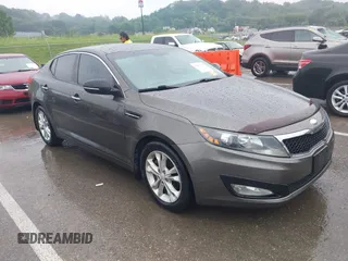 2013 Kia Optima EX z VIN 5XXGN4A79DG181719, wystawiony jako IAAI lot #42372478 z przebiegiem 166 410 mil mil oraz . Historia ofert i sprzedaży dostępna na DreamBid. Obrazek 1.