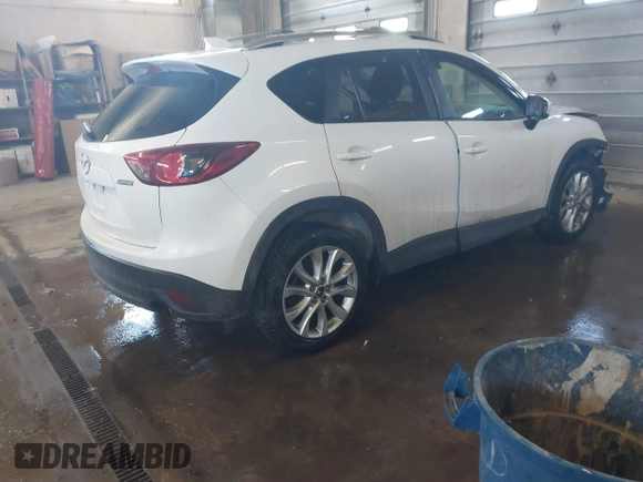 2013 Mazda CX-5 Grand Touring with VIN JM3KE4DE1D0159632, listed as a IAAI auction lot 41524272 with 99,479 mi miles. Bid and sale history available at carsss.com. Image 4.