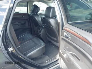 2013 Cadillac SRX Premium Collection with VIN 3GYFNEE34DS535613, listed as a IAAI auction lot 42336365 with 106,426 mi miles and . Bid and sale history available at DreamBid. Image 8.