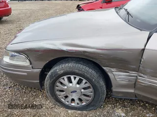 2004 Ford Crown Victoria LX с VIN 2FAFP74W74X114961, выставлен на аукционе IAAI как лот 42347867 с пробегом 170 867 миль миль и . История ставок и продаж доступна на DreamBid. Изображение 6.