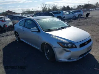 2009 Scion tC with VIN JTKDE167590289105, listed as a IAAI auction lot 41761187 with 195,242 mi miles. Bid and sale history available at carsss.com. Image 1.