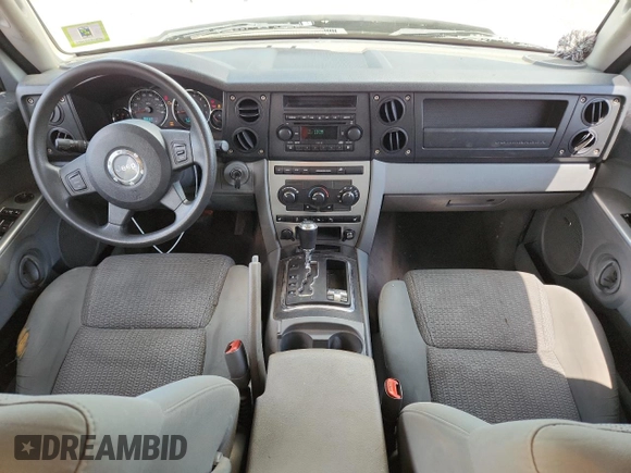2007 Jeep Commander Sport z VIN 1J8HG48P47C691235, wystawiony jako Copart lot #64057505 z przebiegiem 135 641 mil mil oraz Szkoda całkowita • Salvage title. Historia ofert i sprzedaży dostępna na DreamBid. Obrazek 8.