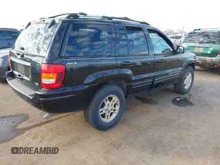 1999 Jeep Grand Cherokee Limited with VIN 1J4GW68NXXC637464, listed as a IAAI auction lot 41561690 with 235,728 mi miles. Bid and sale history available at carsss.com. Image 4.