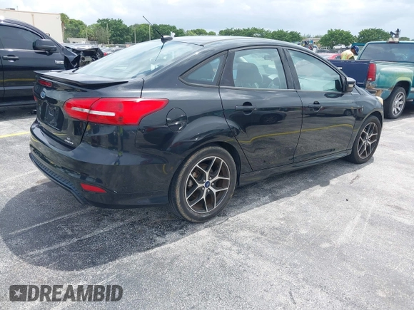 2015 Ford Focus SE with VIN 1FADP3F21FL209221, listed as a IAAI auction lot 42716293 with 100,465 mi miles and . Bid and sale history available at DreamBid. Image 4.