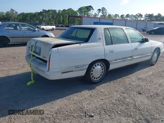 1999 Cadillac DeVille z VIN 1G6KD54Y7XU720668, wystawiony jako IAAI lot #42147461 z przebiegiem 92 054 mil mil oraz . Historia ofert i sprzedaży dostępna na DreamBid. Obrazek 4.