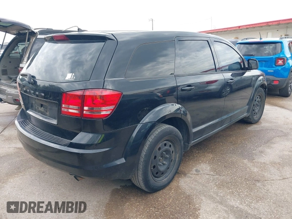 2013 Dodge Journey SE z VIN 3C4PDCAB6DT709917, wystawiony jako IAAI lot #42361943 z przebiegiem 196 891 mil mil oraz . Historia ofert i sprzedaży dostępna na DreamBid. Obrazek 4.