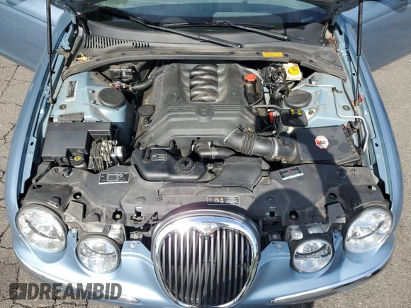 2003 Jaguar S-Type z VIN SAJEA01U53HM73131, wystawiony jako Copart lot #73430914 z przebiegiem 72 730 mil mil oraz Szkody całkowita. Historia ofert i sprzedaży dostępna na DreamBid. Obrazek 12.