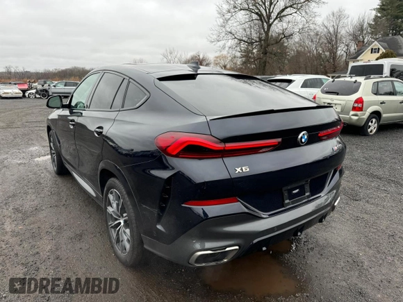 2021 BMW X6 M50i z VIN 5UXCY8C02M9D95172, wystawiony jako Copart lot #84796854 z przebiegiem 75 299 mil mil oraz Czysty tytuł • Clean title. Historia ofert i sprzedaży dostępna na DreamBid. Obrazek 2.