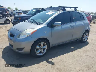 2009 Toyota Yaris with VIN JTDKT903195235991, listed as a IAAI auction lot 42164989 with 249,389 mi miles. Bid and sale history available at carsss.com. Image 2.