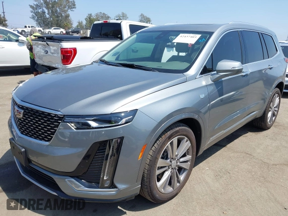 2023 Cadillac XT6 FWD Premium Luxury with VIN 1GYKPCRS6PZ163018, listed as a IAAI auction lot 42437403 with 21,366 mi miles and . Bid and sale history available at DreamBid. Image 2.