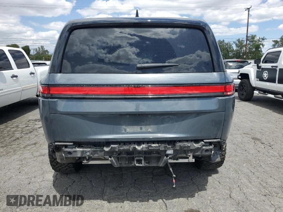 2022 Rivian R1S Launch Edition z VIN 7PDSGABL5NN001018, wystawiony jako Copart lot #56914725 z przebiegiem 26 156 mil mil oraz Szkoda całkowita • Salvage title. Historia ofert i sprzedaży dostępna na DreamBid. Obrazek 6.