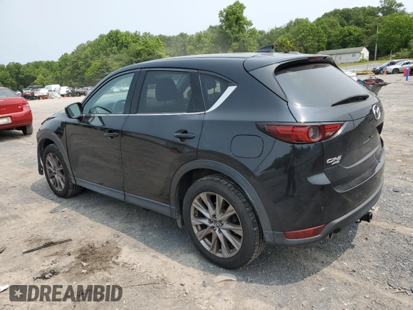 2019 Mazda CX-5 Grand Touring with VIN JM3KFBDM2K0569829, listed as a Copart auction lot 59060965 with 99,359 mi miles and Salvage title. Bid and sale history available at DreamBid. Image 2.