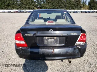 2003 Mazda Protege DX with VIN JM1BJ226231214537, listed as a Copart auction lot 54448615 with 147,753 mi miles and Salvage Title. Bid and sale history available at DreamBid. Image 6.