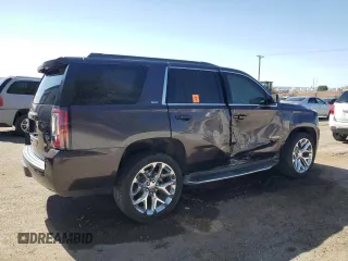 2015 GMC Yukon SLT z VIN 1GKS1BKC5FR689549, wystawiony jako Copart lot #56747385 z przebiegiem 102 856 mil mil oraz Szkoda całkowita • Salvage title. Historia ofert i sprzedaży dostępna na DreamBid. Obrazek 3.