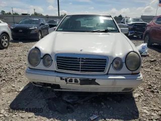 1999 Mercedes-Benz E-Class with VIN WDBJF65H0XA877630, listed as a Copart auction lot 69697454 with 0 mi miles and Salvage Title. Bid and sale history available at carsss.com. Image 5.