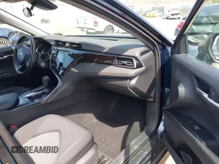2019 Toyota Camry LE with VIN 4T1B11HK6KU276644, listed as a IAAI auction lot 42037249 with 23,677 mi miles and . Bid and sale history available at DreamBid. Image 5.