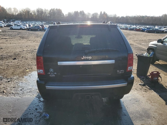 2006 Jeep Grand Cherokee Overland with VIN 1J8HR68256C334929, listed as a Copart auction lot 79450964 with 184,944 mi miles and Salvage Title. Bid and sale history available at carsss.com. Image 6.