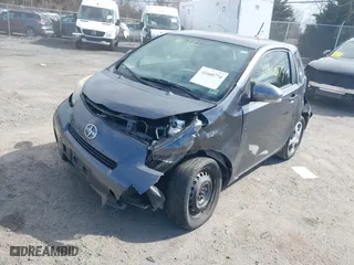 2012 Scion iQ with VIN JTNJJXB04CJ020060, listed as a IAAI auction lot 41660774 with 187,025 mi miles. Bid and sale history available at carsss.com. Image 2.