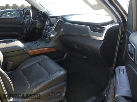 2019 Chevrolet Suburban Premier with VIN 1GNSKJKJ1KR100936, listed as a IAAI auction lot 40489121 with 97,884 mi miles and . Bid and sale history available at DreamBid. Image 5.