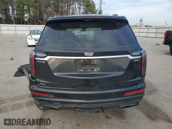 2023 Cadillac XT6 AWD Sport with VIN 1GYKPHRS3PZ150630, listed as a Copart auction lot 43557595 with 54,299 mi miles and Salvage title. Bid and sale history available at DreamBid. Image 6.