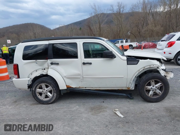 2007 Dodge Nitro SXT with VIN 1D8GU28K77W727391, listed as a IAAI auction lot 41869288 with 214,920 mi miles. Bid and sale history available at carsss.com. Image 13.