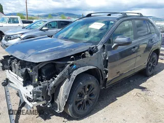 2022 Toyota RAV4 Hybrid SE with VIN JTM16RFV0ND070012, listed as a IAAI auction lot 42244604 with 22,740 mi miles and . Bid and sale history available at DreamBid. Image 2.