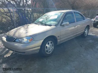 1999 Mercury Mystique GS with VIN 1MEFM6530XK635463, listed as a IAAI auction lot 41478903 with 87,911 mi miles. Bid and sale history available at carsss.com. Image 2.