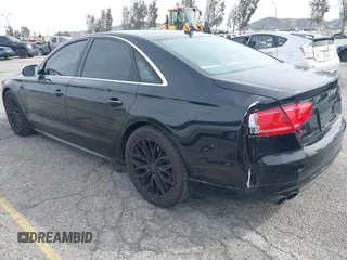 2013 Audi S8 with VIN WAUD2AFD0DN028673, listed as a IAAI auction lot 41689320 with 115,502 mi miles. Bid and sale history available at carsss.com. Image 3.