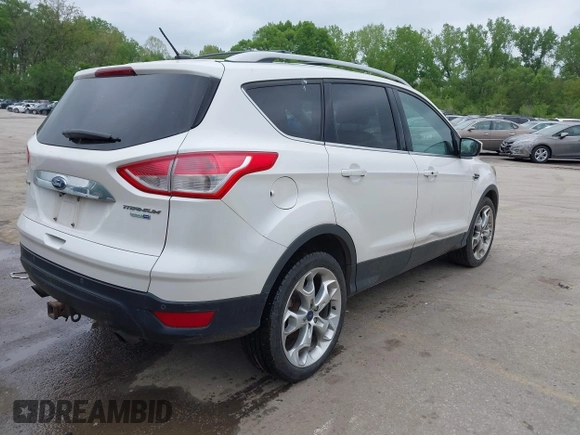 2016 Ford Escape Titanium with VIN 1FMCU9J96GUB97564, listed as a IAAI auction lot 42137663 with 269,009 mi miles. Bid and sale history available at carsss.com. Image 4.