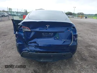 2023 Tesla Model Y Long Range z VIN 7SAYGDEE0PF840787, wystawiony jako IAAI lot #42172489 z przebiegiem 16 314 mil mil oraz . Historia ofert i sprzedaży dostępna na DreamBid. Obrazek 6.