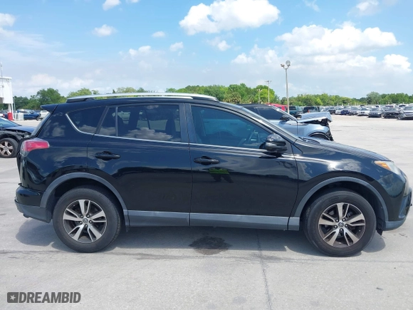 2016 Toyota RAV4 XLE with VIN 2T3WFREV4GW294428, listed as a IAAI auction lot 39168618 with 115,791 mi miles. Bid and sale history available at carsss.com. Image 13.