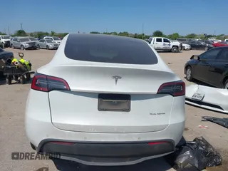 2021 Tesla Model Y Long Range with VIN 5YJYGDEE0MF265339, listed as a IAAI auction lot 41975058 with 51,292 mi miles and . Bid and sale history available at DreamBid. Image 16.